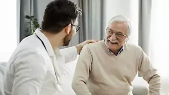 doctor engaging with elderly patient