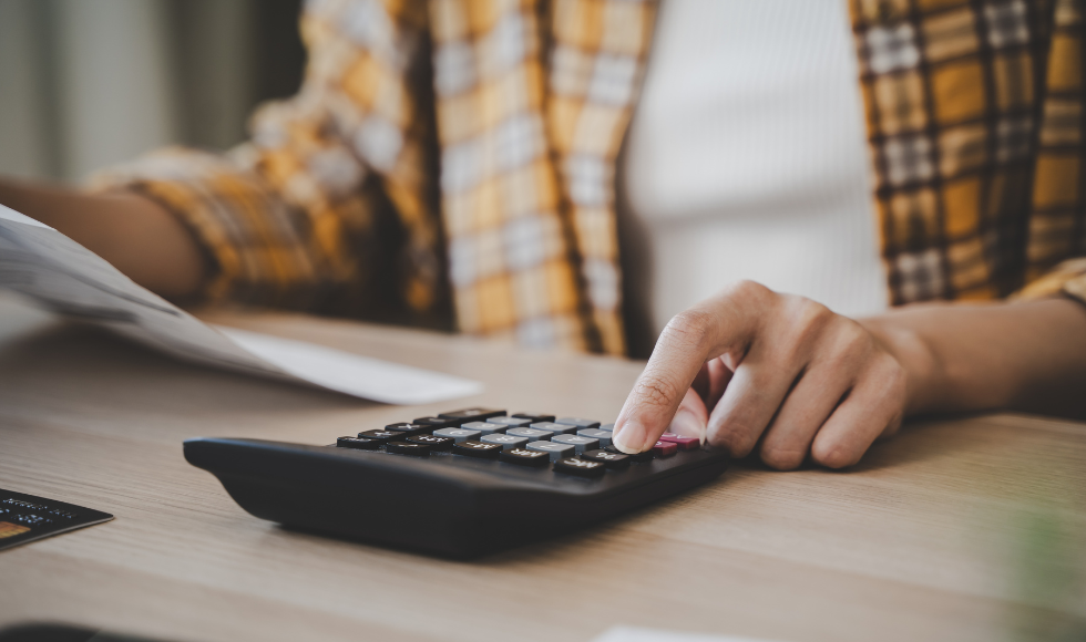 A photo of someone working with a calculator.