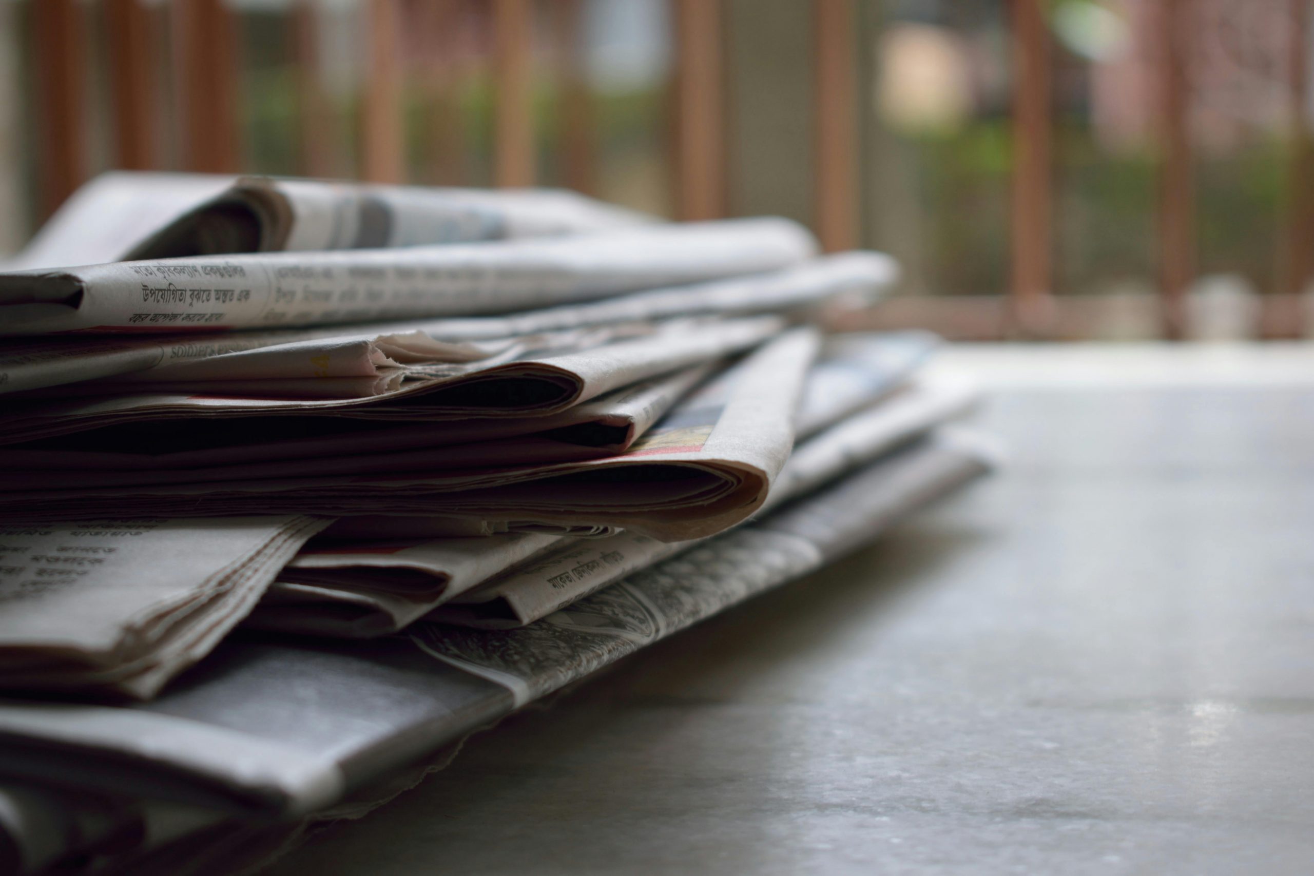 Stack of newspapers on a desk